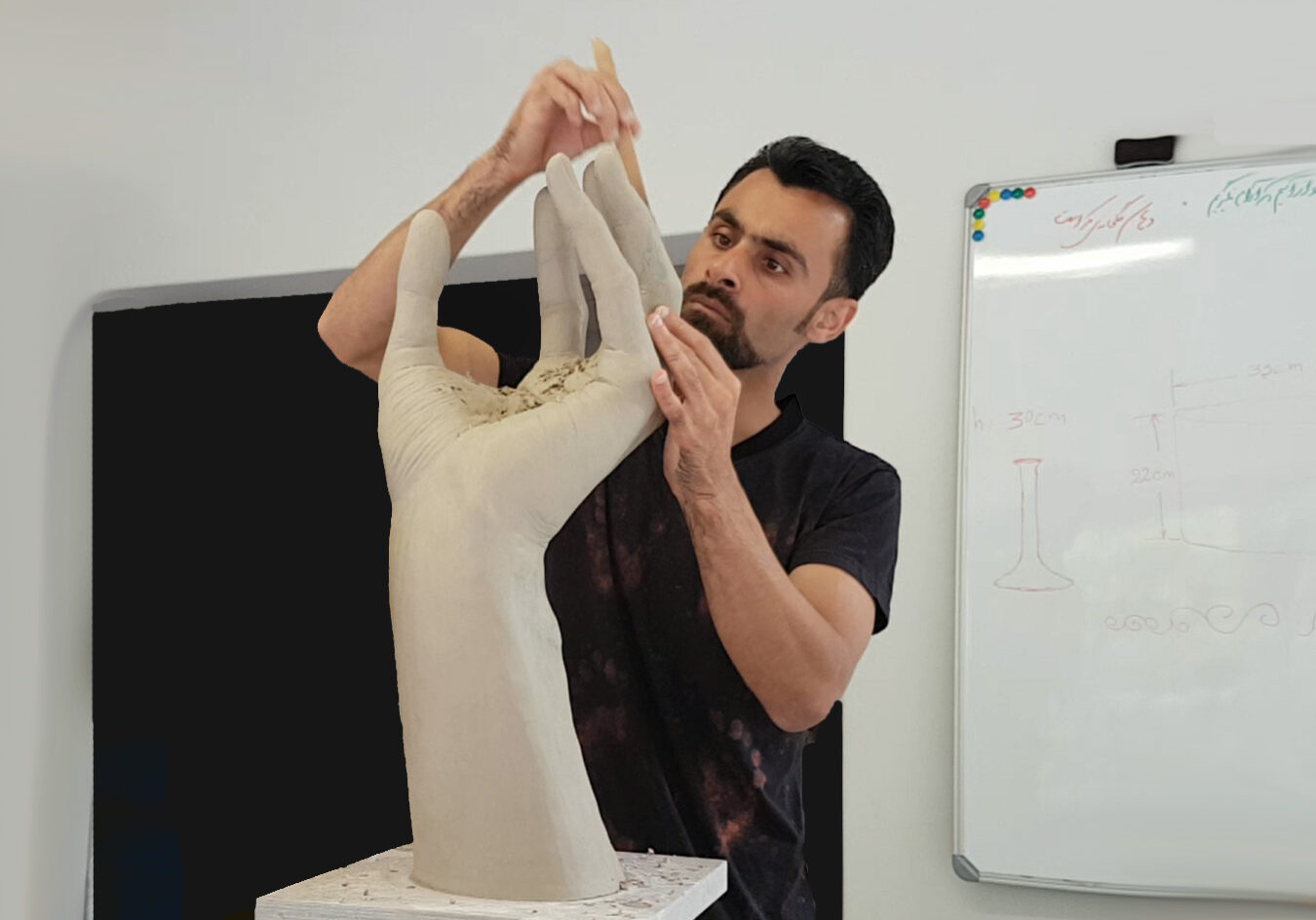 Alan working on large format cupped ceramic hand.